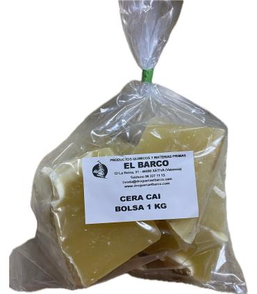 Bloque de cera CAI color amarillo claro, presentado en una bolsa de plástico transparente de un kilogramo con etiqueta blanca.