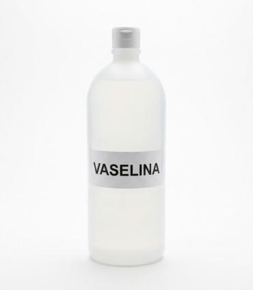 Botella cilíndrica translúcida de 1 litro con tapa blanca, conteniendo vaselina líquida transparente.