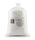 Bolsa transparente de 1Kg llena de escamas blancas de Cloruro de Calcio Técnico al 77%.